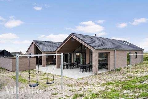 Dette lekre huset med svømmebasseng, nr. 930, med plass til 14 personer, ligger i Vestjylland