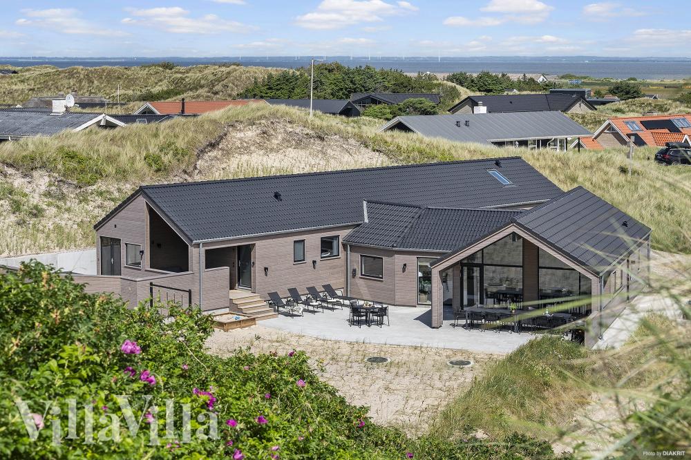 Dette lekre huset med svømmebasseng, nr. 900, med plass til 18 personer, ligger i Vestjylland