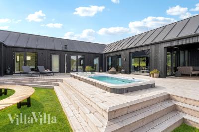Dette lekre huset med spa, nr. 992, med plass til 8 personer, ligger i Sydjylland