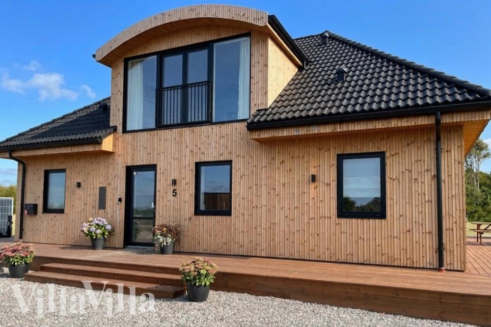 Dette lekre huset med spa, nr. 981, med plass til 14 personer, ligger i Limfjorden