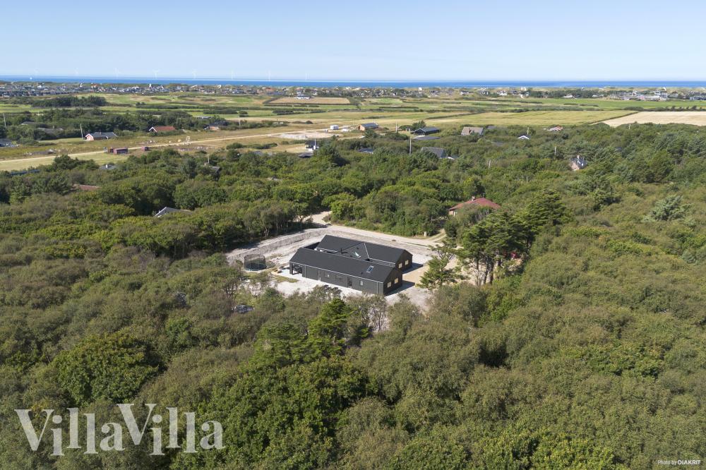 Dette lekre huset med svømmebasseng, nr. 918, med plass til 18 personer, ligger i Vestjylland