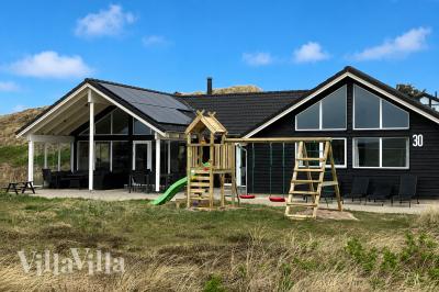 Dette lekre huset med svømmebasseng, nr. 363, med plass til 20 personer, ligger i Vestjylland