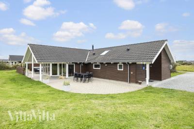 Dette lekre huset med svømmebasseng, nr. 236, med plass til 14 personer, ligger i Nordjylland