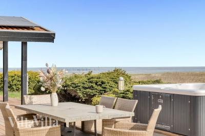 Dette lekre huset med svømmebasseng, nr. 1024, med plass til 12 personer, ligger i Sydjylland